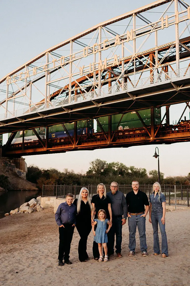 Dr. McDonald's family of 7 taken group photo under the bridge